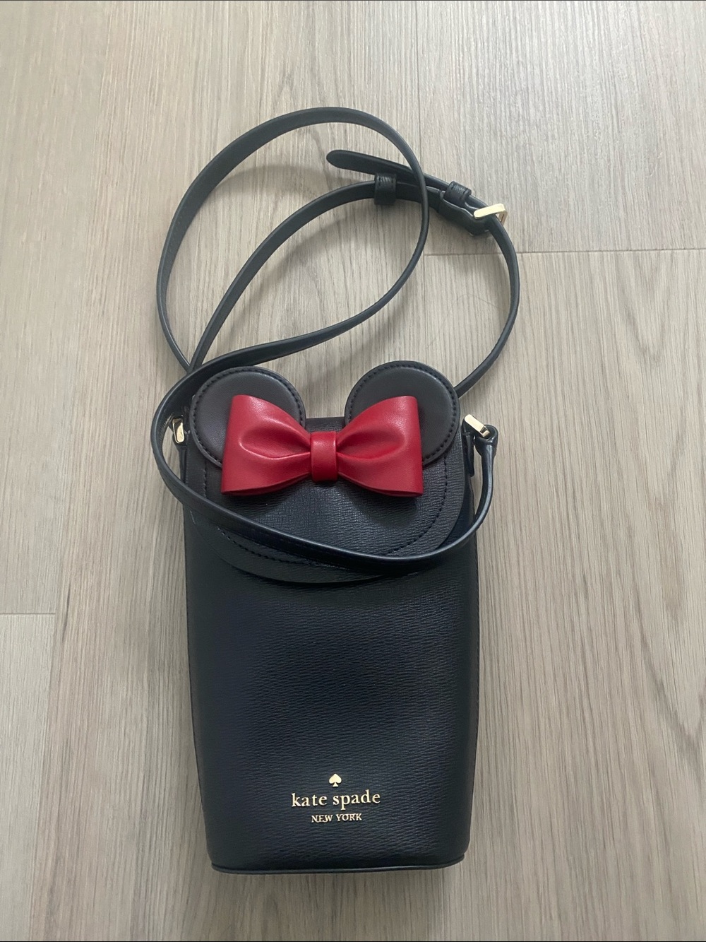 kate spade black crossbody with red bow and ear accents